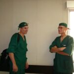 After a long day of operating, Dr. Carey with Lt. Colonel Richard Holt have time to reminisce