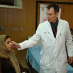 Dr. Carey working with Iraqi civilian trauma victim