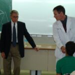 Dr. Carey in discussion with Lt. Colonel Richard Holt and Iraqi doctors concerning injured Iraqi soldier