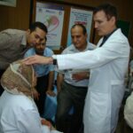 Dr. Carey working with a female patient